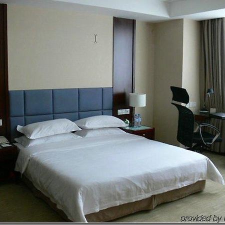New Land Business Hotel Wuhan Chambre photo