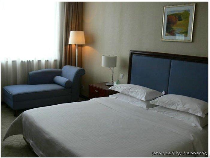 New Land Business Hotel Wuhan Chambre photo